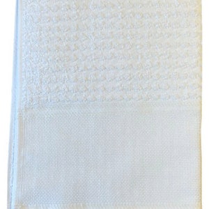 May include: White cotton hand towel with a textured surface and a white border.