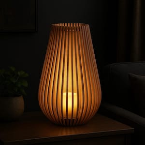 May include: A wooden lantern with a warm, inviting glow. The lantern has a teardrop shape, constructed from vertical wooden slats. A candle inside casts a soft light, creating a cozy ambiance. The lantern is placed on a dark wooden table.