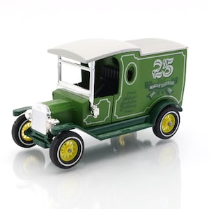 May include: A green and white vintage toy truck with yellow wheels. The truck has the number 25 on the side, along with the text "MODELS OF YESTERYEAR" and "Silver Jubilee Edition". The toy truck is a collectible item.