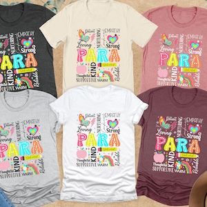 May include: A collection of t-shirts in various colors, including gray, white, and burgundy. Each shirt features the word "PARA" in colorful letters, surrounded by words like "Loving," "Kind," and "Strong," along with graphic elements.