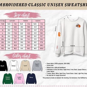 May include: White embroidered unisex sweatshirt with a basketball design on the front. The sleeve has the number 6 and the letters "EE". The size chart shows measurements in inches and centimeters. Available in black, white, sport grey, forest green, sand, light pink, and navy.