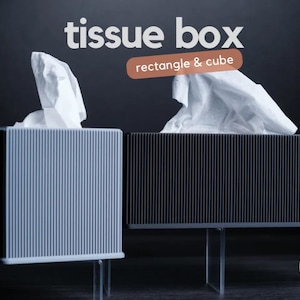 May include: Two tissue boxes, one grey and one black, with a white tissue box cover on each. The boxes are on clear acrylic stands. The text "tissue box" is written in white on a black background above the boxes. The text "rectangle & cube" is written in white on a brown background below the boxes. The text "h3lio design" is written in white on a green background below the boxes.