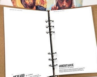 May include: Open planner with blank white pages and a metal binder. The planner is open to reveal the text "REWARD" and "INHERITANCE" with Bible verses listed below. Two religious art cards are visible at the top of the planner.