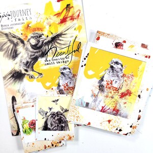 May include: A set of four cards with a yellow background and white borders. The cards feature a bird illustration with the text "Beautiful, the beauty of small things".