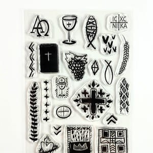 May include: Clear stamp set featuring various religious symbols in black ink. Includes a chalice, cross, fish, grapes, and other Christian icons. The stamps are arranged on a clear sheet for easy use in crafting and art projects.