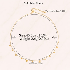 May include: A gold disc chain necklace featuring small circular charms spaced along the chain. The necklace has a total length of 15.94 inches, a weight of 0.09 ounces, and a 1.97-inch tail chain. The discs measure 0.11 inches and 0.16 inches in diameter.