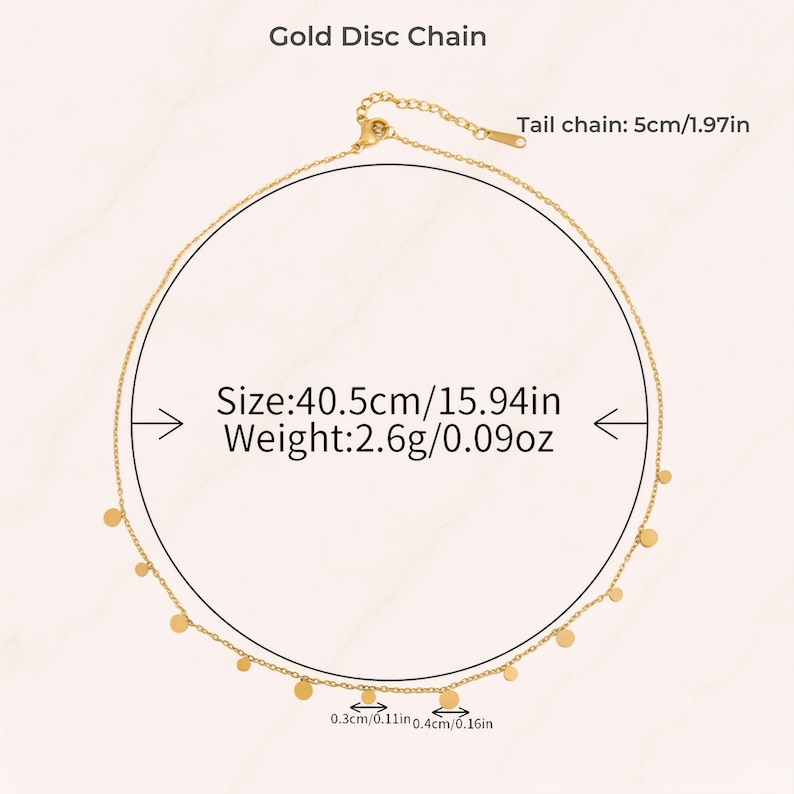 May include: A gold disc chain necklace featuring small circular charms spaced along the chain. The necklace has a total length of 15.94 inches, a weight of 0.09 ounces, and a 1.97-inch tail chain. The discs measure 0.11 inches and 0.16 inches in diameter.