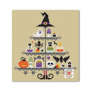 May include: A cross-stitch pattern featuring a Halloween-themed tiered stand with a witch's hat, ghosts, bats, spiders, potions, pumpkins, and candy corn. The stand is decorated with black and white lace and sits on top of a pair of witch's boots. The pattern is titled "Stitching 4 Seasons".