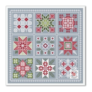 May include: A cross stitch pattern sampler with nine different designs featuring red, green, and white snowflakes and stars on a blue background. The pattern is titled "Stitching 4 Seasons".