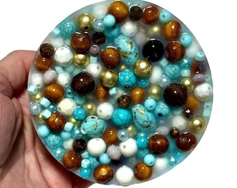 Almohadilla sensorial para recoger con joyas turquesas: juguete antiestrés y para la ansiedad. Sorpresa oculta.