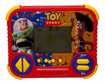 Raro juego portátil LCD de Disney Toy Story de Tiger Electronics de 1994: Woody y Buzz Lightyear.
