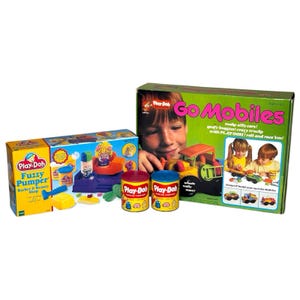 May include: A selection of Play-Doh sets, featuring a "Fuzzy Pumper" barber shop kit and a "Go Mobiles" set. The boxes are brightly coloured with images of children and the Play-Doh products. Two tins of Play-Doh are also visible.