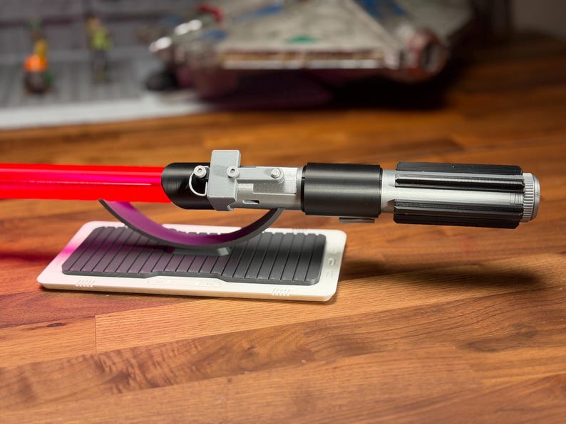 May include: A set of three ceramic mugs with a speckled, matte finish. The mugs are in shades of cream, light grey, and dark grey. Each mug has a simple, minimalist design, ideal for coffee or tea.