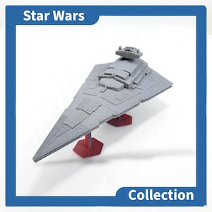May include: A grey Star Wars Imperial Star Destroyer model. The model is displayed on a red stand. The words "Star Wars" and "Collection" are in the image.