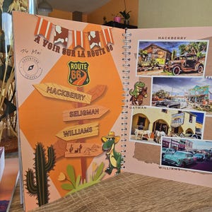 May include: A colorful travel journal with a Route 66 theme. The cover features a vintage Route 66 sign, a dinosaur, and a cactus. The inside pages have photos of various locations along Route 66, including Hackberry, Seligman, and Williams.