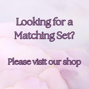 May include: A digital graphic with a soft, watercolor-like background in shades of pink, purple, and gold. Text in a dark purple font reads "Looking for a Matching Set? Please visit our shop."