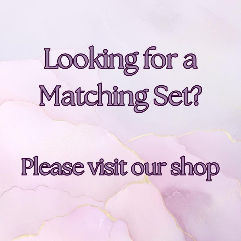 May include: A digital graphic with a soft, watercolor-like background in shades of pink, purple, and gold. Text in a dark purple font reads "Looking for a Matching Set? Please visit our shop."
