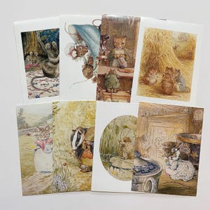 May include: A set of eight vintage postcards featuring illustrations of animals from Beatrix Potter's children's books. The illustrations include a cat, a badger, a mouse, and a rabbit.