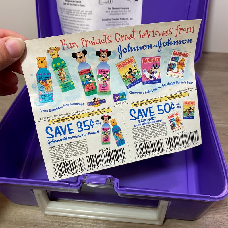 May include: A colorful coupon sheet with a purple background featuring a variety of Johnson & Johnson products, including Band-Aid bandages and Johnson's bath time products. The coupons offer savings of 35% and 50% on any Johnson's bath time product and Band-Aid brand adhesive bandages. The coupons expire on 12/31/98 and 12/21/98.