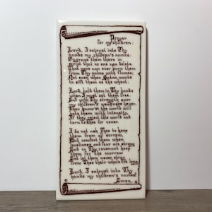 May include: A rectangular ceramic tile with a prayer written in dark red script. The text, titled "Prayer for my children," is framed by decorative scroll elements. The tile is off-white with a glossy finish.