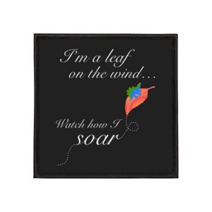 May include: Black square patch with the text "I'm a leaf on the wind... Watch how I soar." A colorful leaf illustration in orange, red, blue, and green is featured. The patch has a black border.