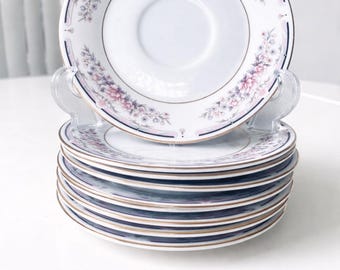 Juego de 8 platillos de porcelana fina con diseño floral vintage para té.