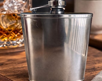 Petaca vintage Houdini de acero inoxidable, ideal para regalar en el bolsillo.