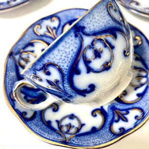 Flow Blue Tea Cup with Saucer – Ridgway “Penshurst” – Staffordshire Ironstone Antique c. 1900 Individual Set