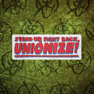 May include: A rectangular sticker with the words "STAND UP FIGHT BACK, UNIONIZE!" in red and blue lettering. The sticker is on a textured green background with repeating black graphic designs.