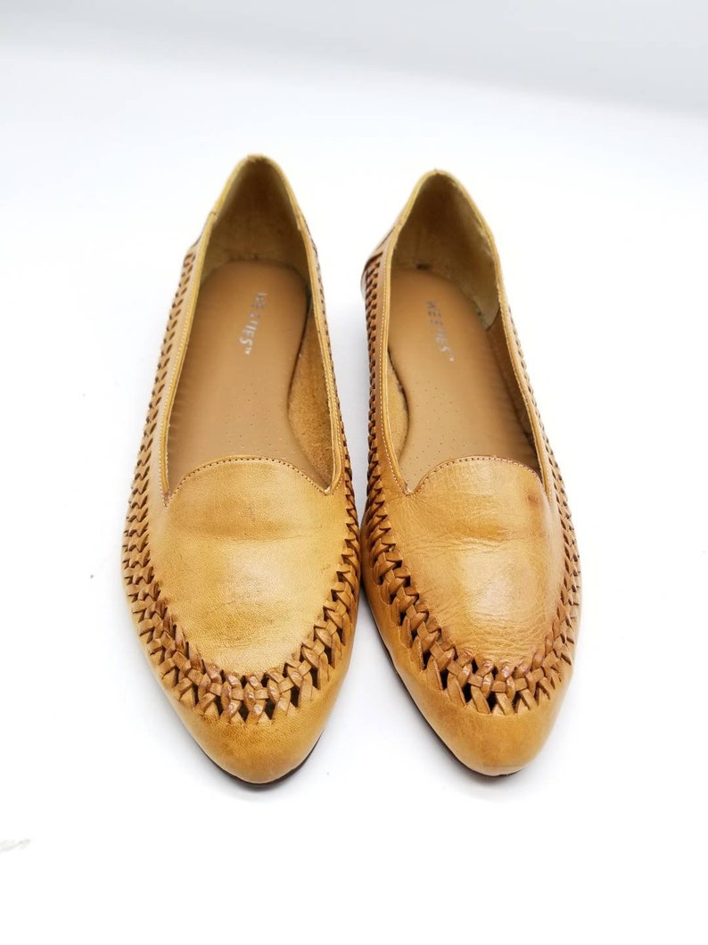 pointy tan flats