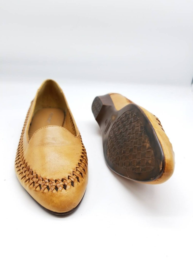 pointy tan flats