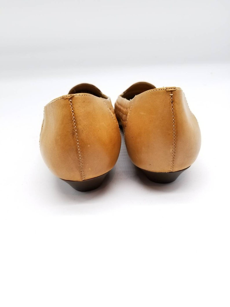 pointy tan flats