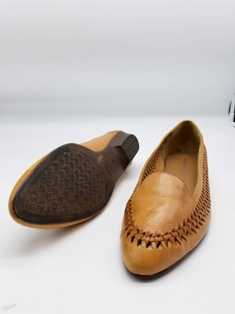 pointy tan flats