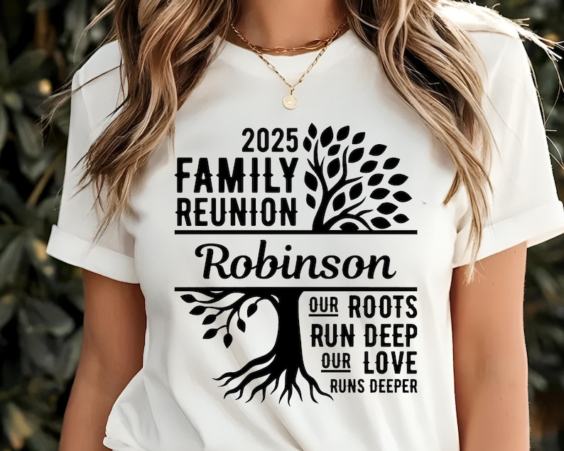 May include: White t-shirt with black text and a tree graphic. The text reads "2025 Family Reunion Robinson" above a tree design, with the words "Our Roots Run Deep, Our Love Runs Deeper" below.