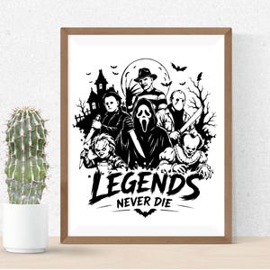 May include: A framed black and white art print featuring iconic horror movie characters including a masked figure, a doll, and a clown, with a haunted house and moon in the background. The text "LEGENDS NEVER DIE" is printed at the bottom.