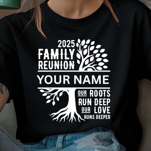 May include: Black t-shirt with a white graphic design for a 2025 family reunion. The design includes a tree with the text "Family Reunion," "Your Name," and the quote "Our Roots Run Deep, Our Love Runs Deeper."