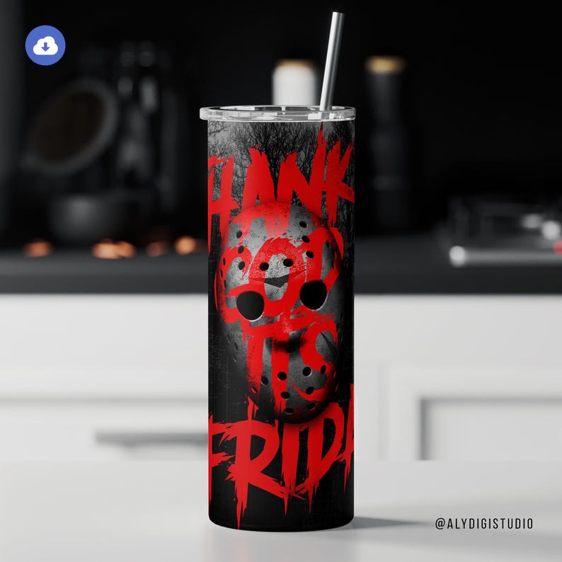 May include: A stainless steel tumbler with a black background and a red graphic of a hockey mask with the words "HANK IT'S FRIDAY" in red. A silver straw is inserted into the lid. The tumbler is cylindrical.