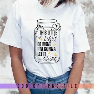 May include: White t-shirt with a black and white graphic of a mason jar with the text "This little light of mine I'm gonna let it shine".