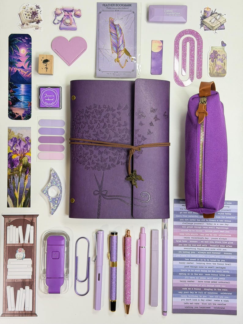 May include: A collection of purple stationery items, including a journal with butterfly designs, pens, a pencil case, stickers, and a bookmark. The items are arranged on a white surface, creating a visually appealing layout for journaling and creative projects.