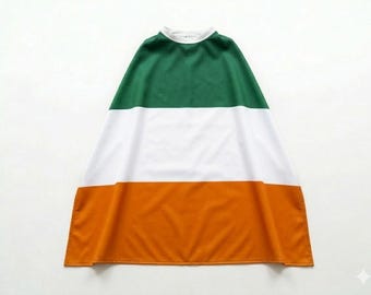 May include: A green, white, and orange cape, resembling the Irish flag, with a white collar. The cape is made of a soft fabric and is designed to be worn. The colors are vibrant and clearly defined.