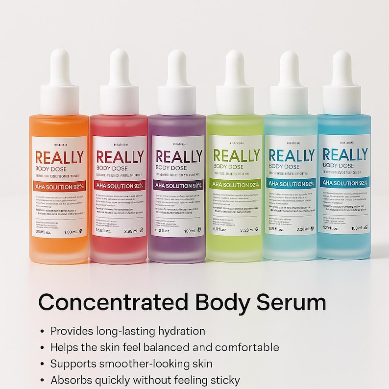 May include: Six bottles of body serum in orange, red, purple, green, light blue, and blue. Each bottle has a white dropper and is labeled "REALLY BODY DOSE AHA SOLUTION 92%." The text "Concentrated Body Serum" is below the bottles.