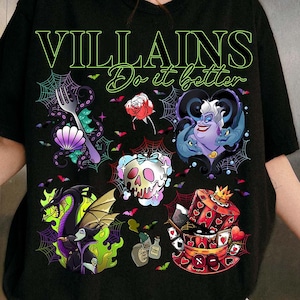 May include: Black t-shirt with the text "VILLAINS Do it better" in green. The shirt features colorful illustrations of various Disney villains, including Ursula, Maleficent, and the Queen of Hearts, surrounded by spiderwebs and bats.