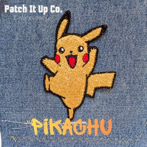 May include: A gold glitter Pikachu patch with black detailing, red cheeks, and an open mouth. The word "Pikachu" is written in colourful letters below. The patch is on a blue denim background.