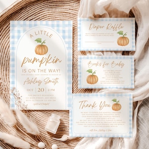 May include: Baby shower invitation set with a blue gingham pattern and pumpkin illustrations. Includes an invitation, diaper raffle card, book request card, and thank you card. The invitation reads "A Little Pumpkin is on the Way!"