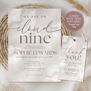 May include: A baby shower invitation and matching thank you tag. The invitation reads "We are on cloud nine" and includes details for Sophie Edwards' baby shower. The tag says "thank you!" and includes the baby shower date.