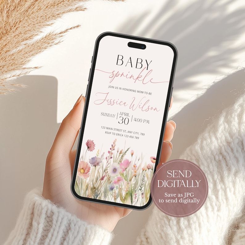 May include: A digital invitation for a baby sprinkle with a floral design. The invitation says "Baby Sprinkle" in pink script and "Join us in honoring Mom-to-be Jessica Wilson" in black text. The date is Sunday, April 30th at 4:00 PM. The address is 123 Main Street St, Any City, 789. The RSVP number is 123 456 789.