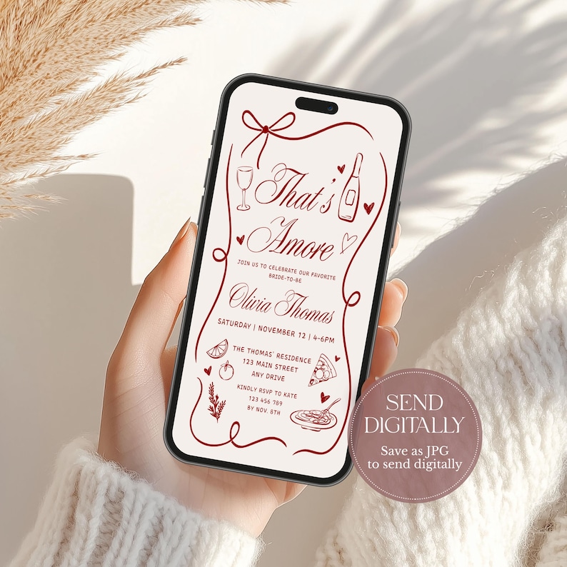 May include: A smartphone displays a digital invitation with the text "That's Amore" in a decorative font. The invitation includes event details, illustrations, and a call to send digitally.