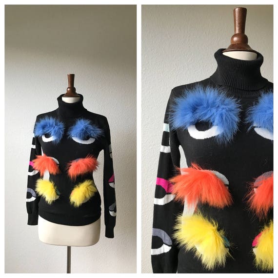 kitschy black turtleneck sweater with colorful fur