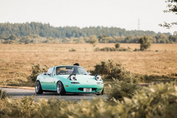 mazda mx5 silly googly eyes headlight covers miata eunos roadster
