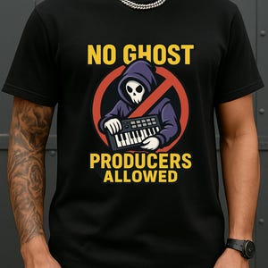 May include: Black t-shirt with a graphic featuring a hooded skull figure playing a keyboard, inside a red circle with a line through it. The text "NO GHOST" and "PRODUCERS ALLOWED" are in yellow.